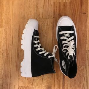 Very good condition Converse high tops with subtle platform.